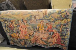 A modern tapestry hanging depicting grape harvesting.