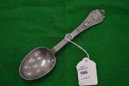 A cast pewter spoon.