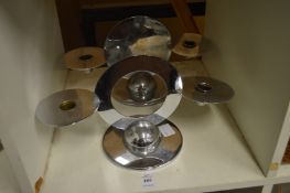 A pair of stylish chrome candelabra.