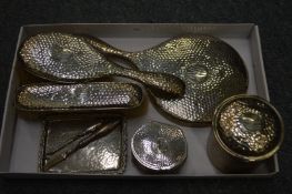 A silver dressing table set engraved with the initals H.A.B.