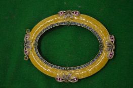 An enamel photograph frame.