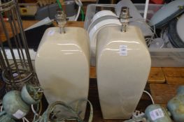 A pair of pottery table lamps.