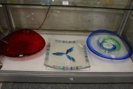 Three colourful glass dishes.