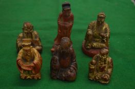 Collection of carved and gilded Chinese wood figures.