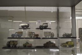Ten model military vehicles.