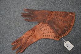 A pair of ladies Elizabethan style leather gloves.