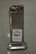 A Dunhill silver plated table lighter with original box and paperwork.