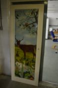 A door decoratively painted with a woodland scene with animals.