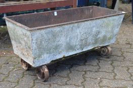 A cast iron rectangular trough on wrought iron feet.