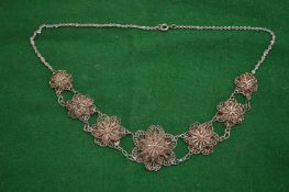 A filigree necklace.