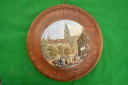 A porcelain pot lid, A French Street Scene, framed.