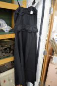 A Ladies black satin full length dress.