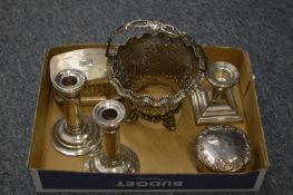 A pair of silver candlesticks, dressing table jar and cover, a dwarf candlestick, pair of silver