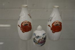 A Chinese painted porcelain snuff bottle and a pair of Chinese porcelain vases.