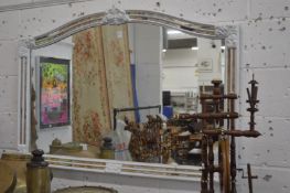 A decorative over mantle mirror.