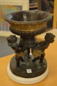 An impressive bronze and marble centre piece, the bowl being supported by three cherubs.