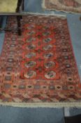 A Bokhara rug, 160cm x 105cm together with two small rugs.
