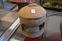 A Nigerian carved wood food bowl and cover.