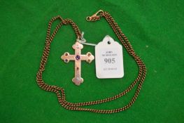 A 9ct gold cross on chain, inset with various gem stones.
