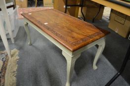 An Eastern brass inlaid hardwood and painted coffee table.