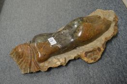 Carlos de Almeida, a carved marble sculpture of a reclining female nude.