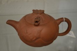 A Chinese Yixing teapot.