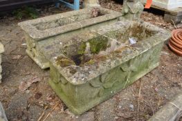 A pair of composite rectangular garden troughs.