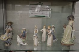 A large Lladro figure of a young lady wearing a broad brimmed hat leaning against a balustrade