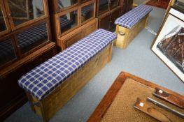 A pair of rustic pine and upholstered long stools.