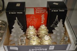Frosted glass Christmas tree models, pinecone candle holders and a pair of glass angels.