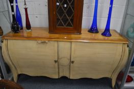 A large French style part painted Bombe two door commode.