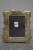 An Art Nouveau design silver photograph frame.