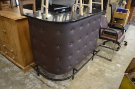 An L shaped cocktail bar.