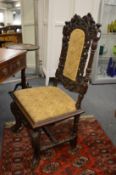 Carved walnut high back dining chair.
