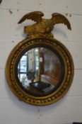 A Regency convex mirror with eagle mount.
