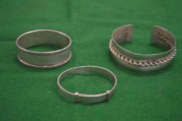 Three silver bangles.