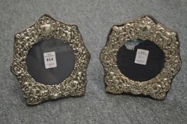 A pair of Victorian embossed silver photograph frames.