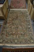 A good Persian rug with floral decoration 180cm x 120cm.