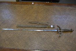 A sword and scabbard with tapering double edged blade, wire bound grip with ornate brass pommel