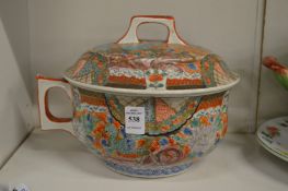 A Japanese Imari chamber pot and cover.