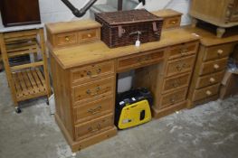 A pine pedestal dressing table.