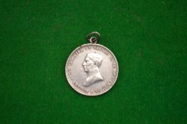 A Uruguay coin dated 1917 with later suspension loop.