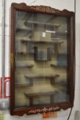 A Chinese rosewood hanging display cabinet.