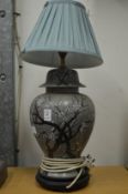 A Chinese pottery vase lamp.