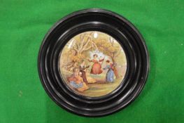 A porcelain pot lid, The Swing (very rare), framed.