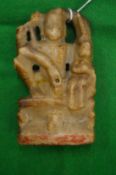 An early Indian carved soapstone figure of a deity.