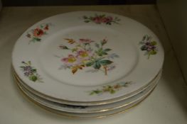 A set of four Continental floral decorated porcelain plates signed Farge.