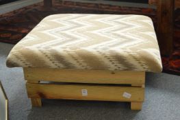 A rustic pine foot stool.