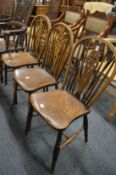Three beech, ash and elm wheelback single dining chairs.