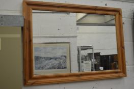 A pine framed mirror.